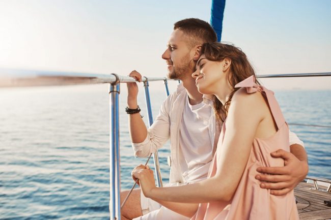 Couple on yacht illustrates blog "Yacht Insurance: What You Need To Know"
