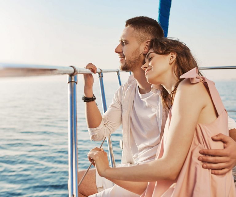 Couple on yacht illustrates blog "Yacht Insurance: What You Need To Know"