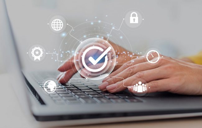 Closeup of person typing illustrates blog "Is Cyber Liability the Same as Professional Liability?"