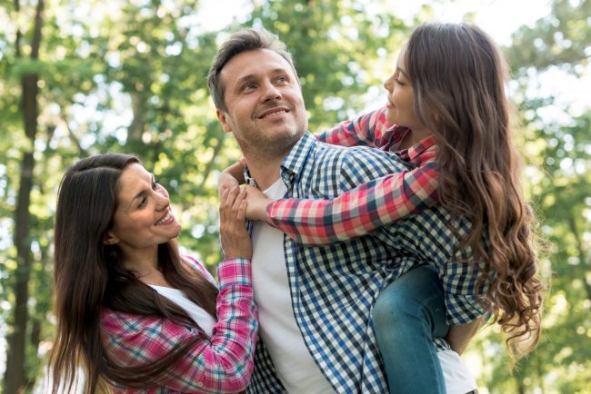 family-FP Photo of happy family illustrates blog "How Many Types of Life Insurance Are There?"