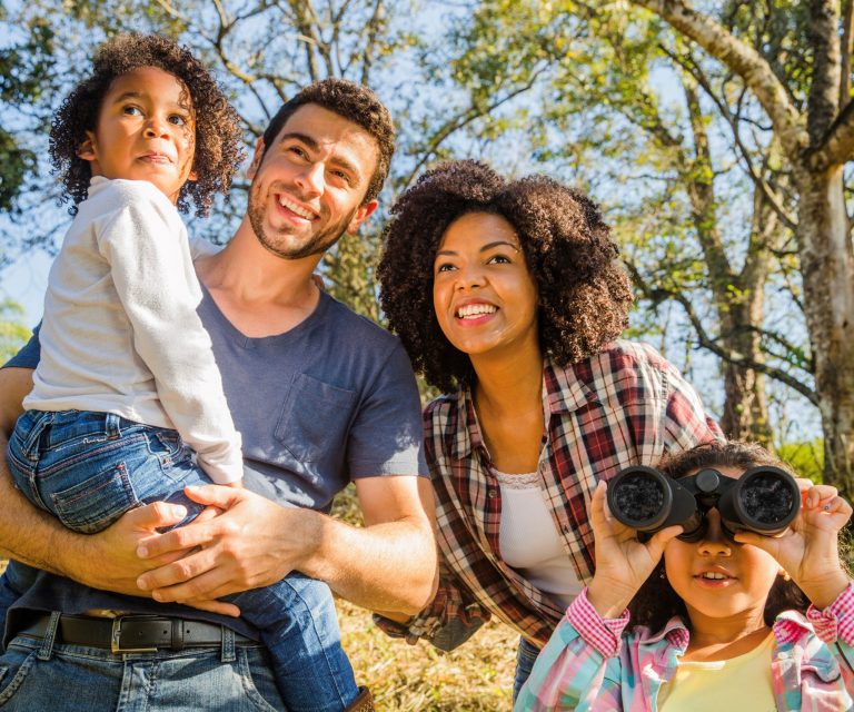 Family with dad, mom, and two kids, illustrate blog "What Is Permanent Life Insurance?"
